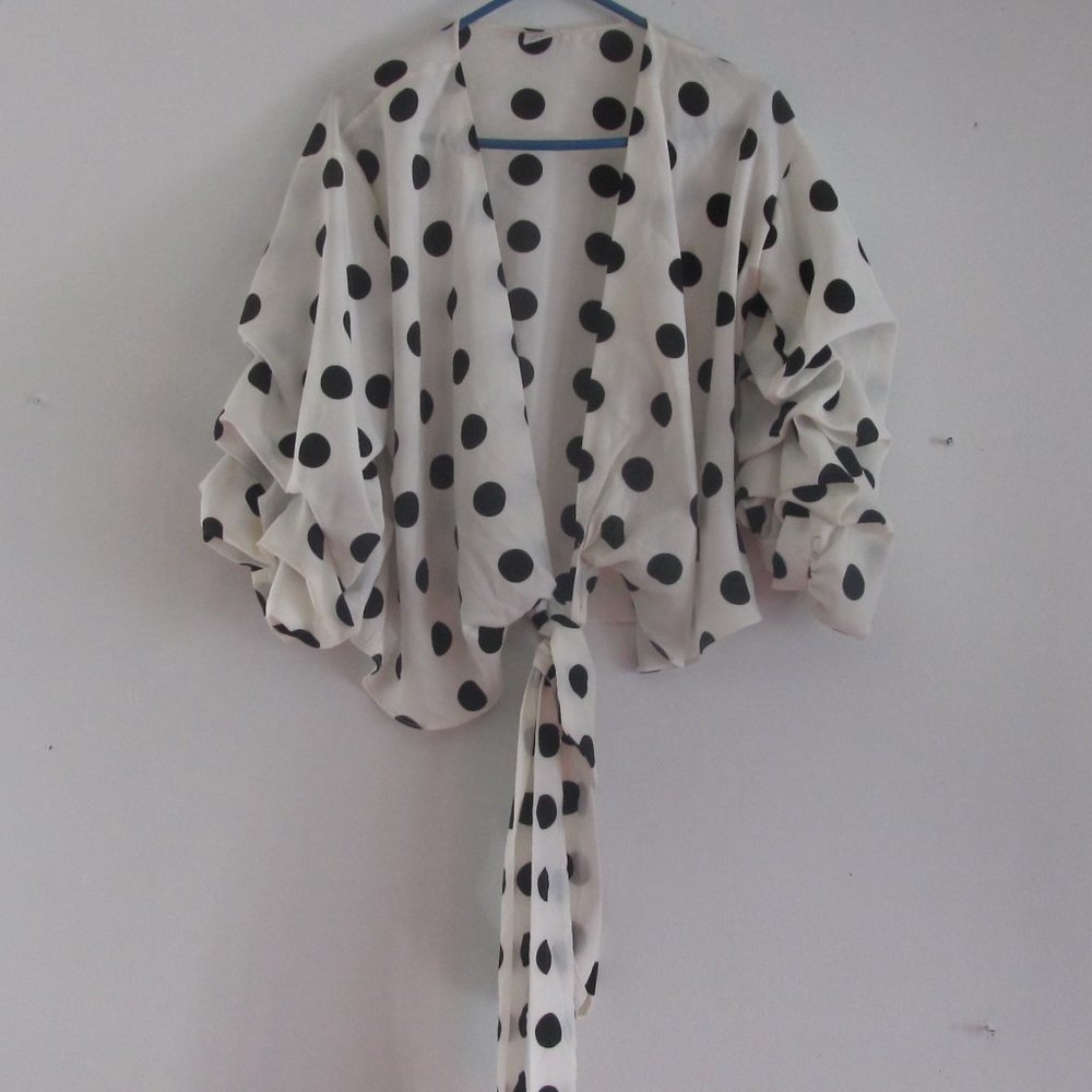 This Soft-Flowing Blouse is decorated with polka-dots